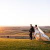 a newly wedded couple at the sunrise