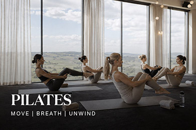 A group of women doing pilates in a beautiful room
