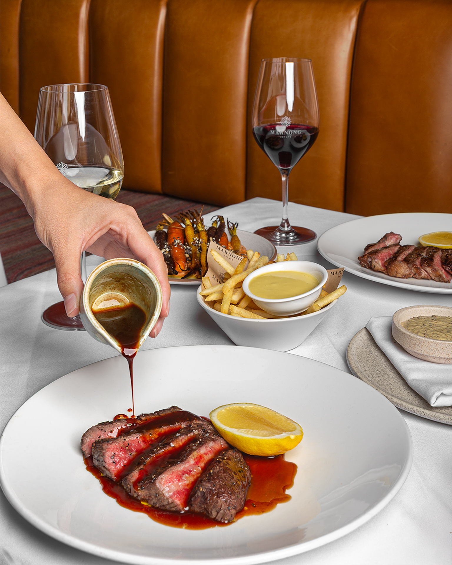 Steak finished with jus at the table at La Vètta