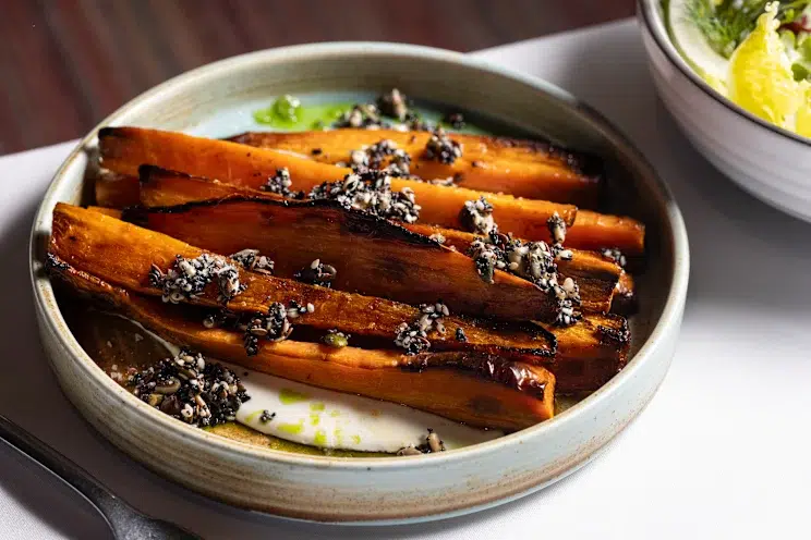 Carrots blistered in the wood oven with seeds and herb oil at La Vètta