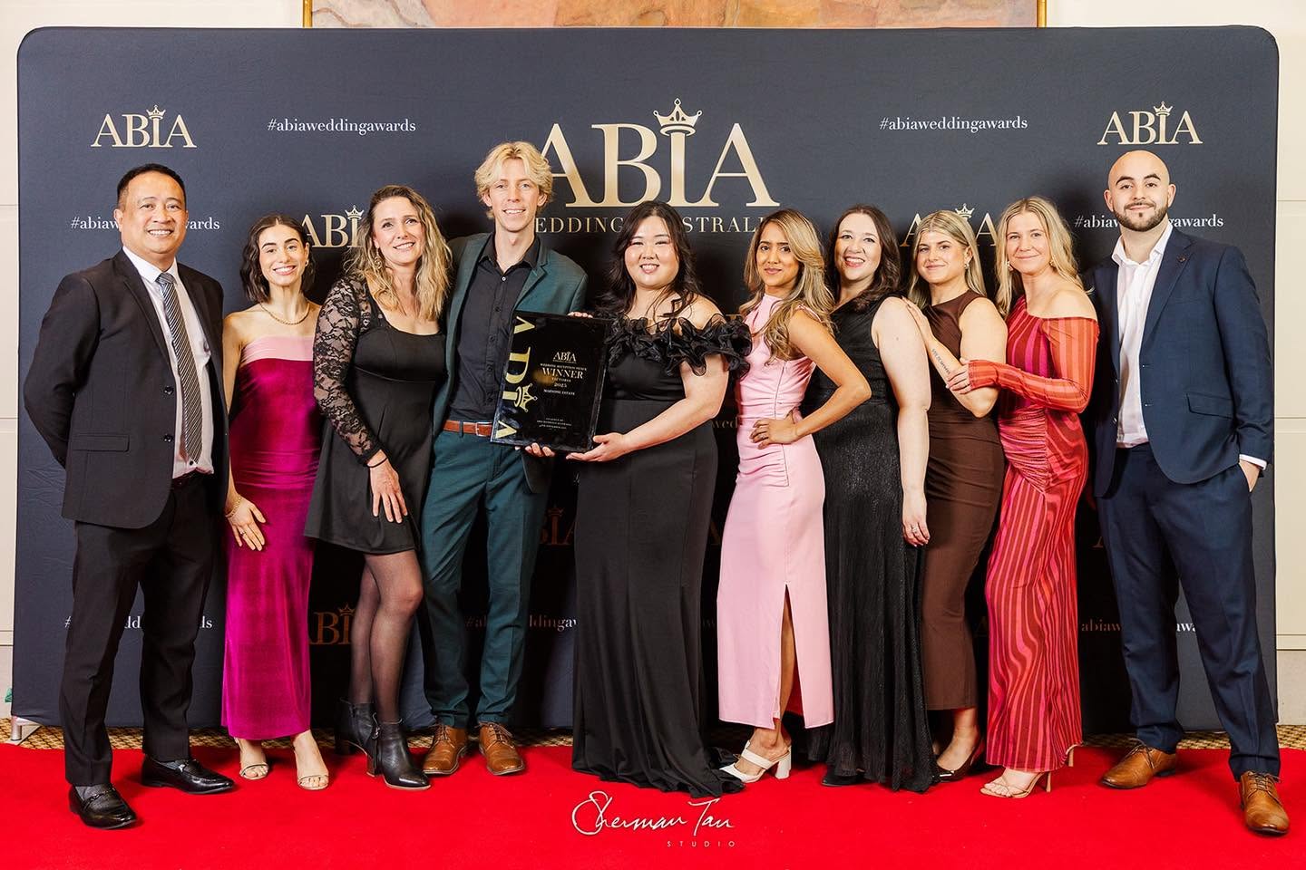 The Marnong Estate team holding the Wedding Reception Venue winner's trophy at the 2025 Victorian ABIA Wedding Awards
